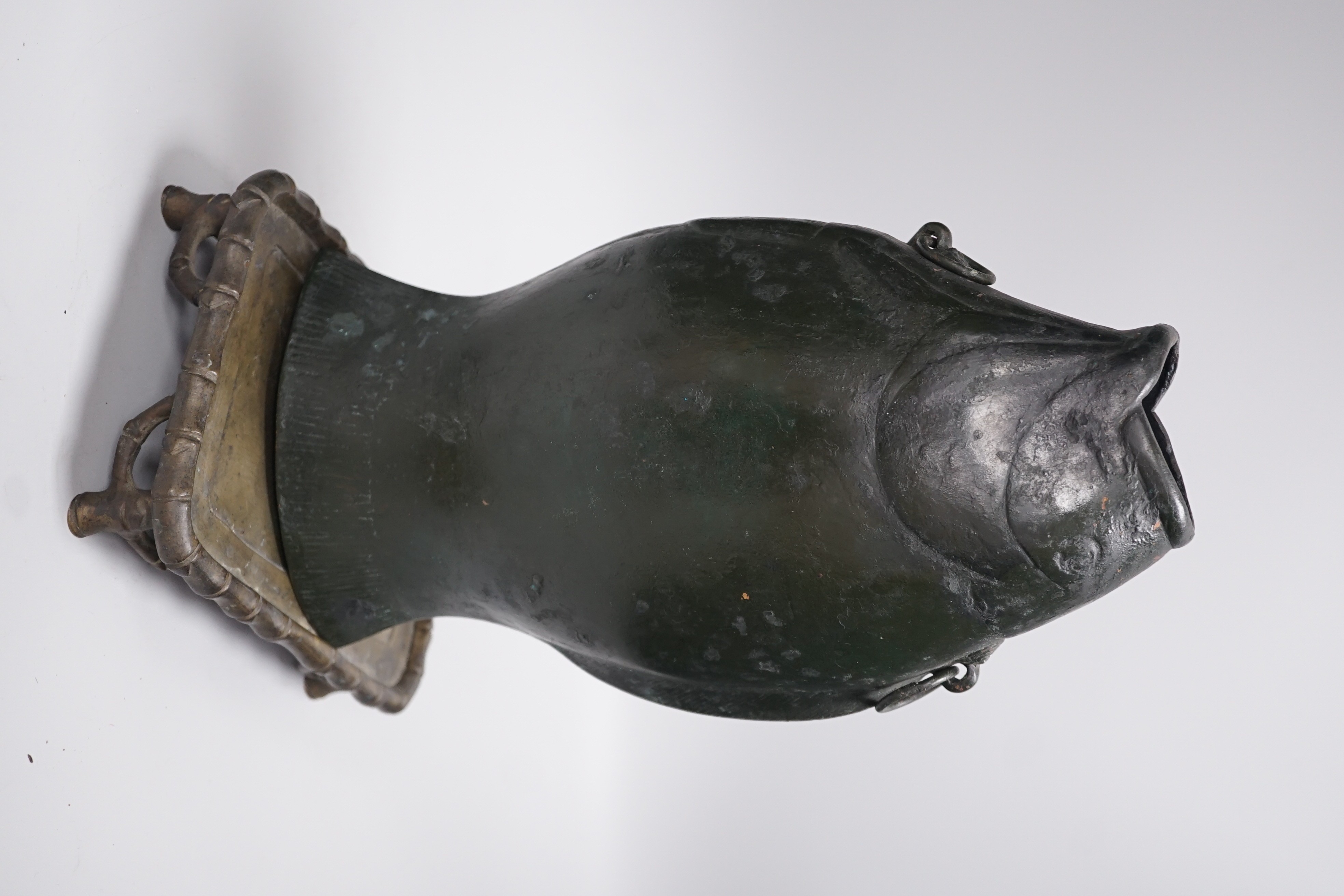 A bronze fish-shaped vase and an associated Chinese rectangular bronze stand, 32cm